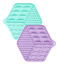 Load image into Gallery viewer, Two silicone mats, one teal and one purple, with bone-shaped cavities on a white background.