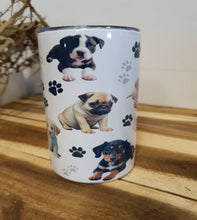 Load image into Gallery viewer, Tumbler with dog illustrations and paw prints on a wooden surface