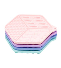 Load image into Gallery viewer, Stack of pink, purple, and green silicone coasters on a white background
