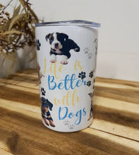 Load image into Gallery viewer, Tumbler with dog illustration and text 'Life is better with dogs' on a wooden surface.