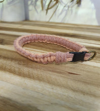Load image into Gallery viewer, Pink collar with a black clip on a wooden surface