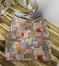 Load image into Gallery viewer, Patchwork Coat with multicolor patterns on a wooden surface