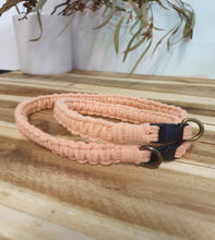 Load image into Gallery viewer, Peach dog collar with black clip on a wooden surface