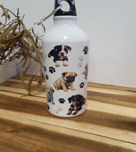 Load image into Gallery viewer, White water bottle with dog illustrations on a wooden surface