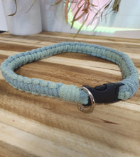 Load image into Gallery viewer, Blue braided dog collar with a black clip on a wooden surface
