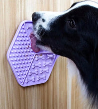 Load image into Gallery viewer, Dog interacting with a purple textured mat on a wooden floor

