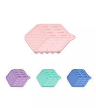 Load image into Gallery viewer, Set of four hexagonal silicone mats in pink, purple, green, and blue on a white background.
