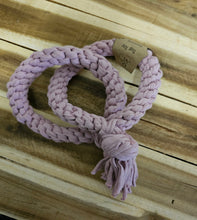 Load image into Gallery viewer, A Mauve chunky braided pet toy with a tassel, coiled on a wooden plank background.
