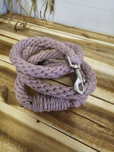 Load image into Gallery viewer, A thick, twisted Mauve rope with a silver metal snap hook clasp, coiled on a rustic wooden plank surface.

