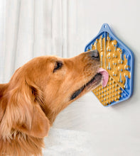 Load image into Gallery viewer, Dog interacting with a yellow and blue dog puzzle toy on a white background
