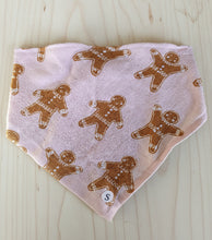 Load image into Gallery viewer, Fabric with gingerbread man pattern on a pink background
