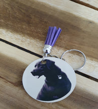 Load image into Gallery viewer, Keychain with purple tassel and Labrador design on a wooden surface
