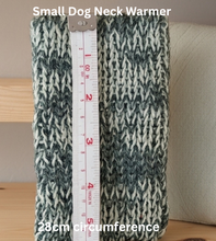 Load image into Gallery viewer, Small dog neck warmer with a measuring tape indicating its circumference on a neutral background.
